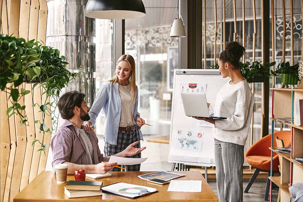 Three person discussion whiteboard