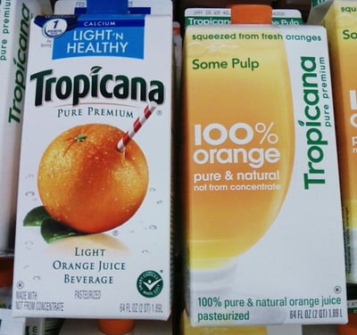 Tropicana packaging before and after its 2009 redesign. Left, the original Pure Premium carton with the orange-and-straw image shoppers recognized. Right, the 2009 redesign that replaced it.